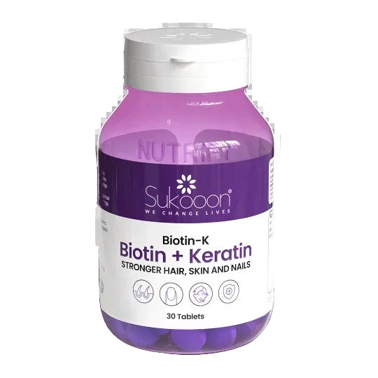 Purple supplement bottle labeled 'Sukoooon' with text about Biotin-Keratin on a white background